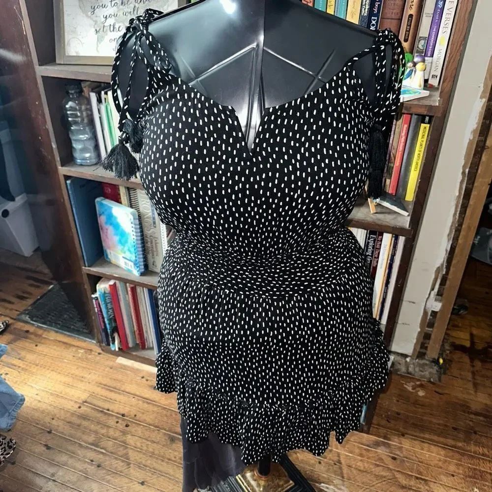Saltwater Luxe S ruffled black polka dot flowy mini dress